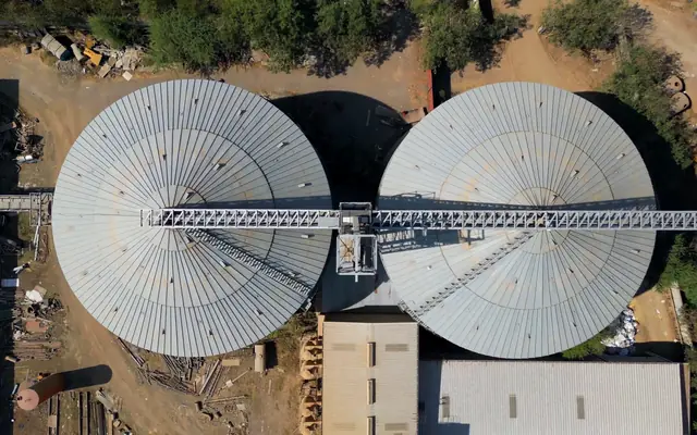 Top-down drone view of the two 12,500 MT seed silos at the Dhule plant